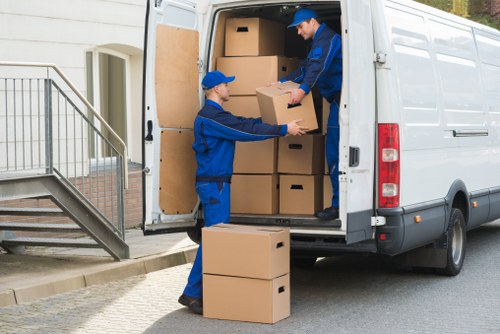 Packed boxes and furniture prepared for house removals in Lee
