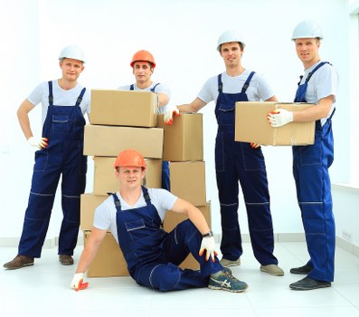 Fragile items being wrapped and packed for a local move in Lee