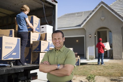 Office equipment and boxes prepared for commercial moves in Lee