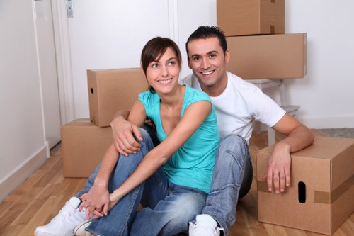 Trained movers handling furniture carefully during a home move
