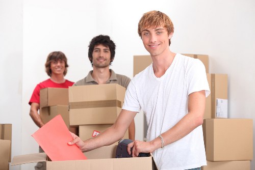 Removal team loading household items for a move in Lee